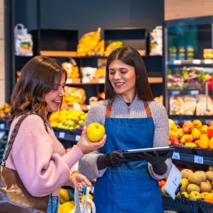 Worker and customer in grocery store